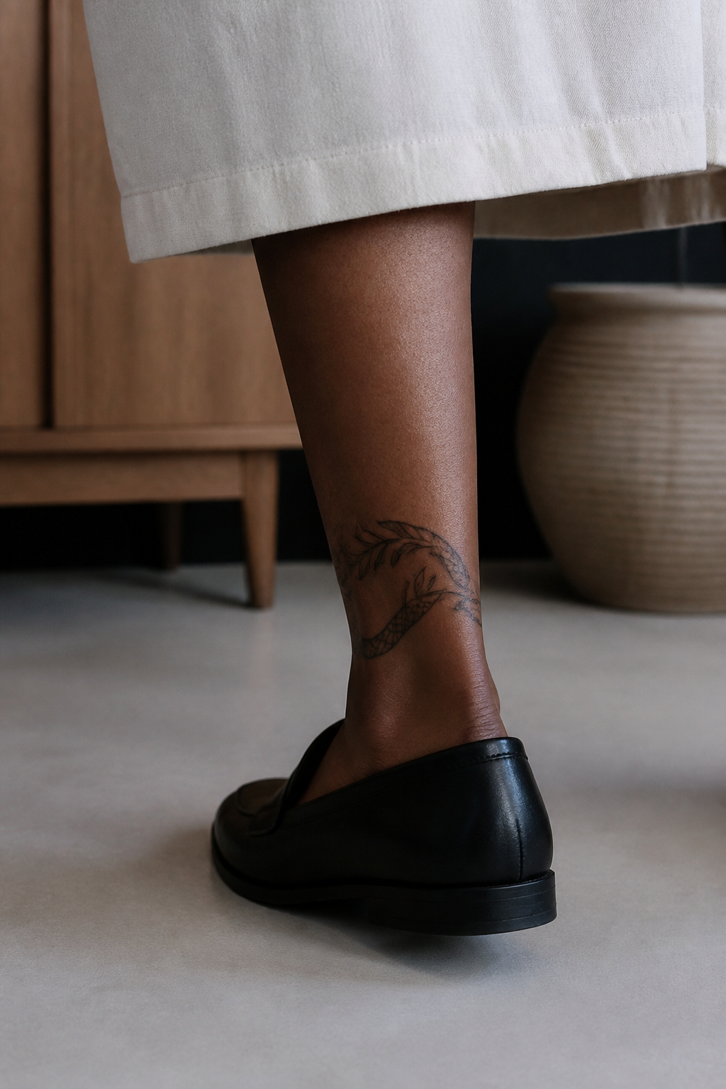 Snake Wrap tattoo shown from a distinct editorial angle