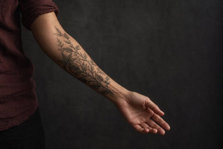 Healed botanical forearm tattoo showing natural placement and flow