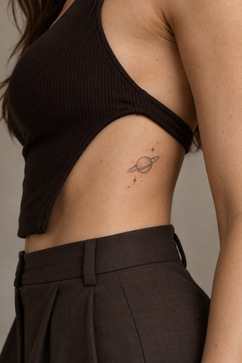 Fine line rib tattoos for women: Small Saturn Tattoo On The Ribs