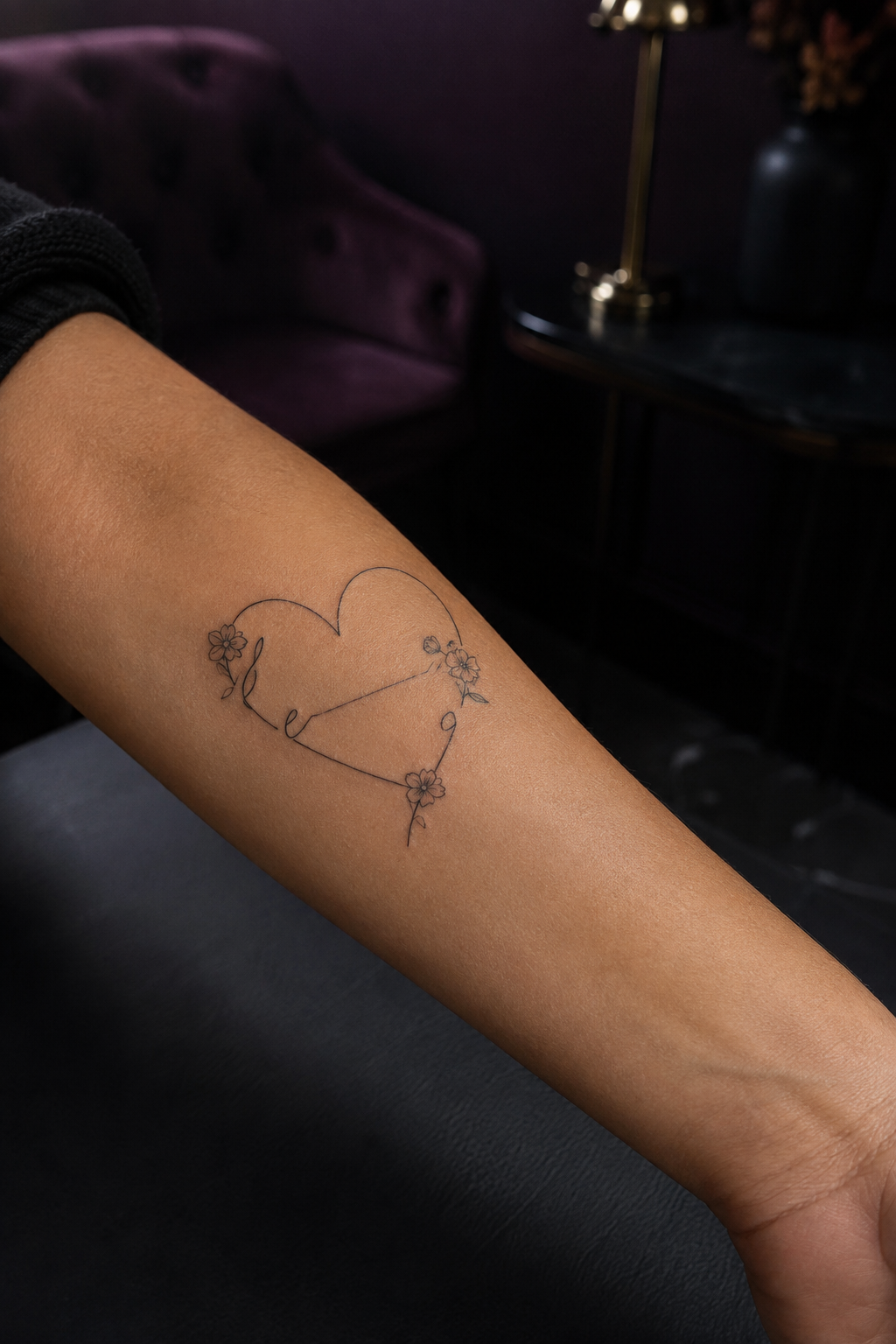 Thin heart outline with script-like lines and small flowers