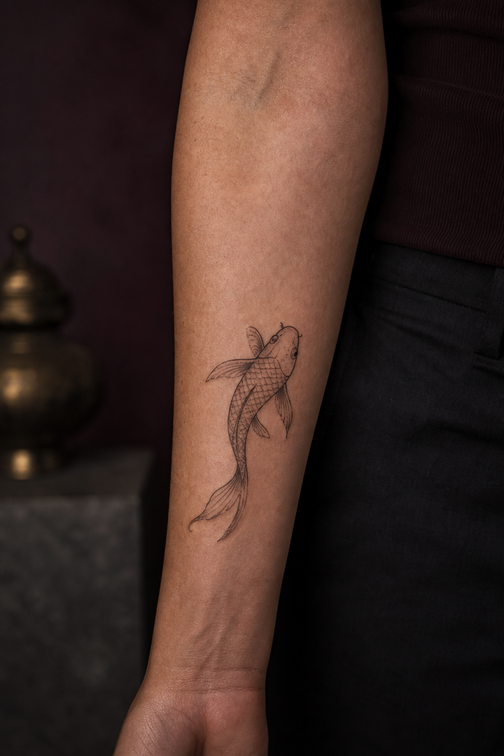 koi fish forearm tattoo ideas — simple line-art koi