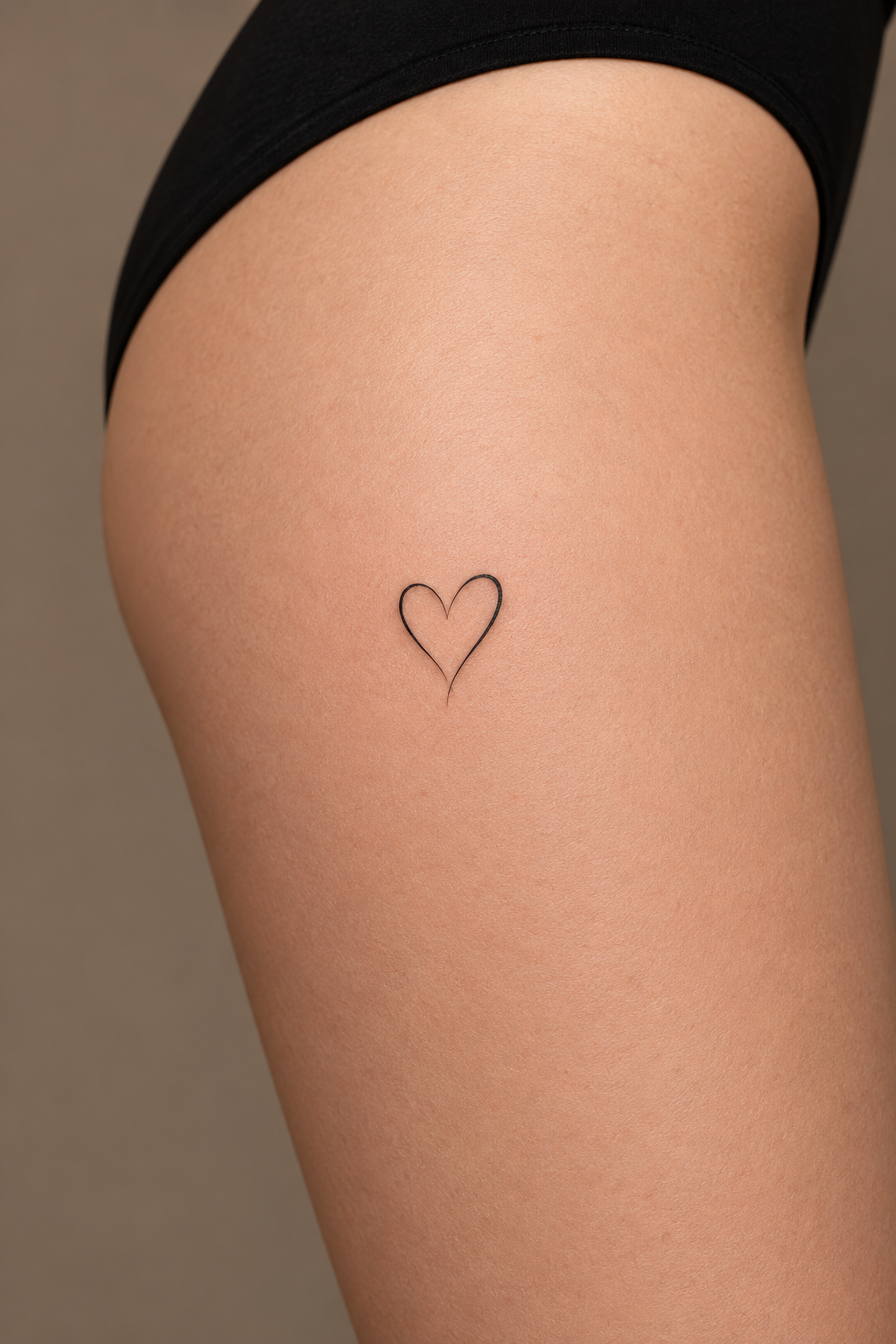 Tiny Heart small thigh tattoo idea