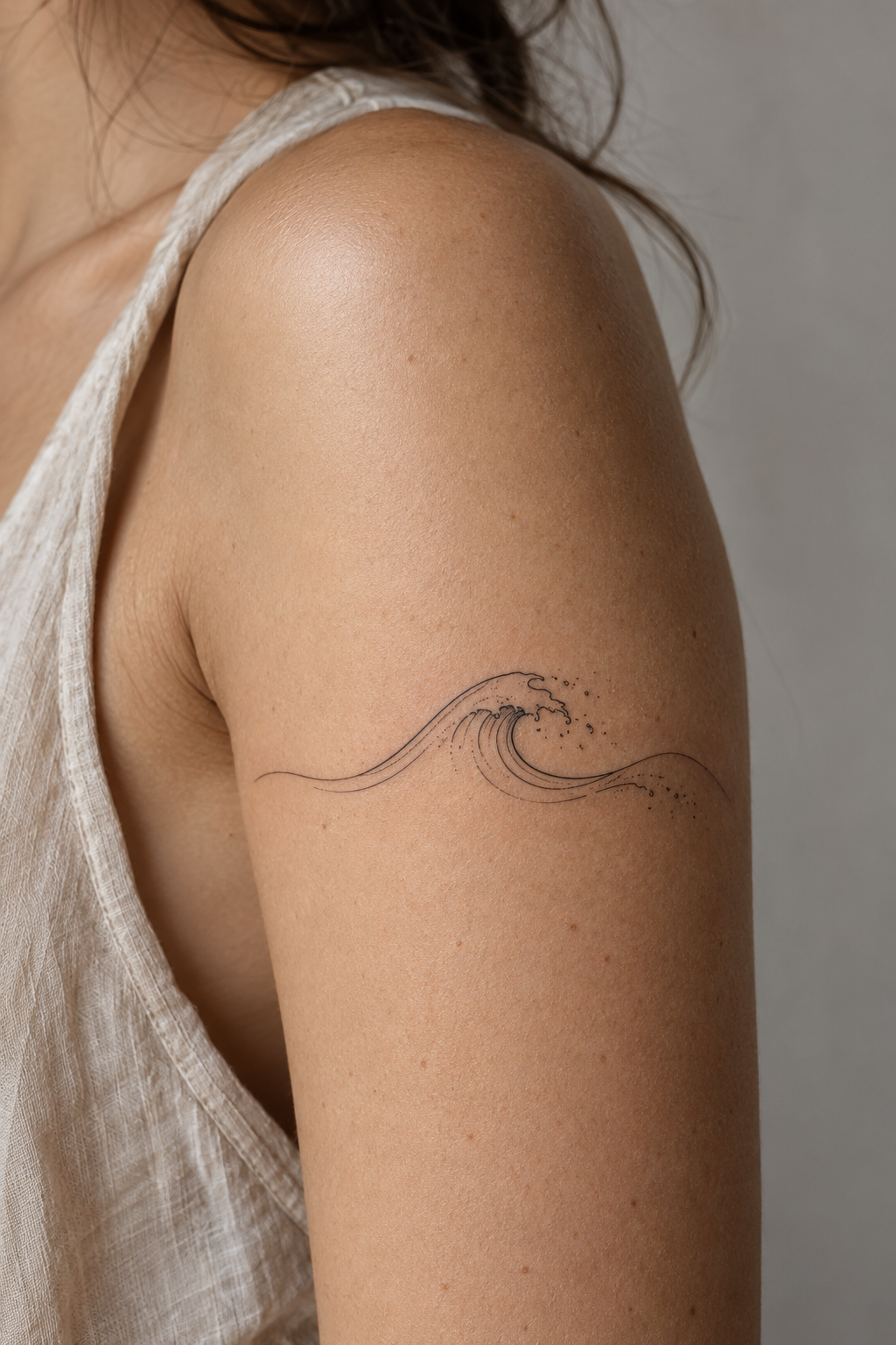 Tiny Meaningful Tattoo Ideas For Women featuring a simple wave symbol