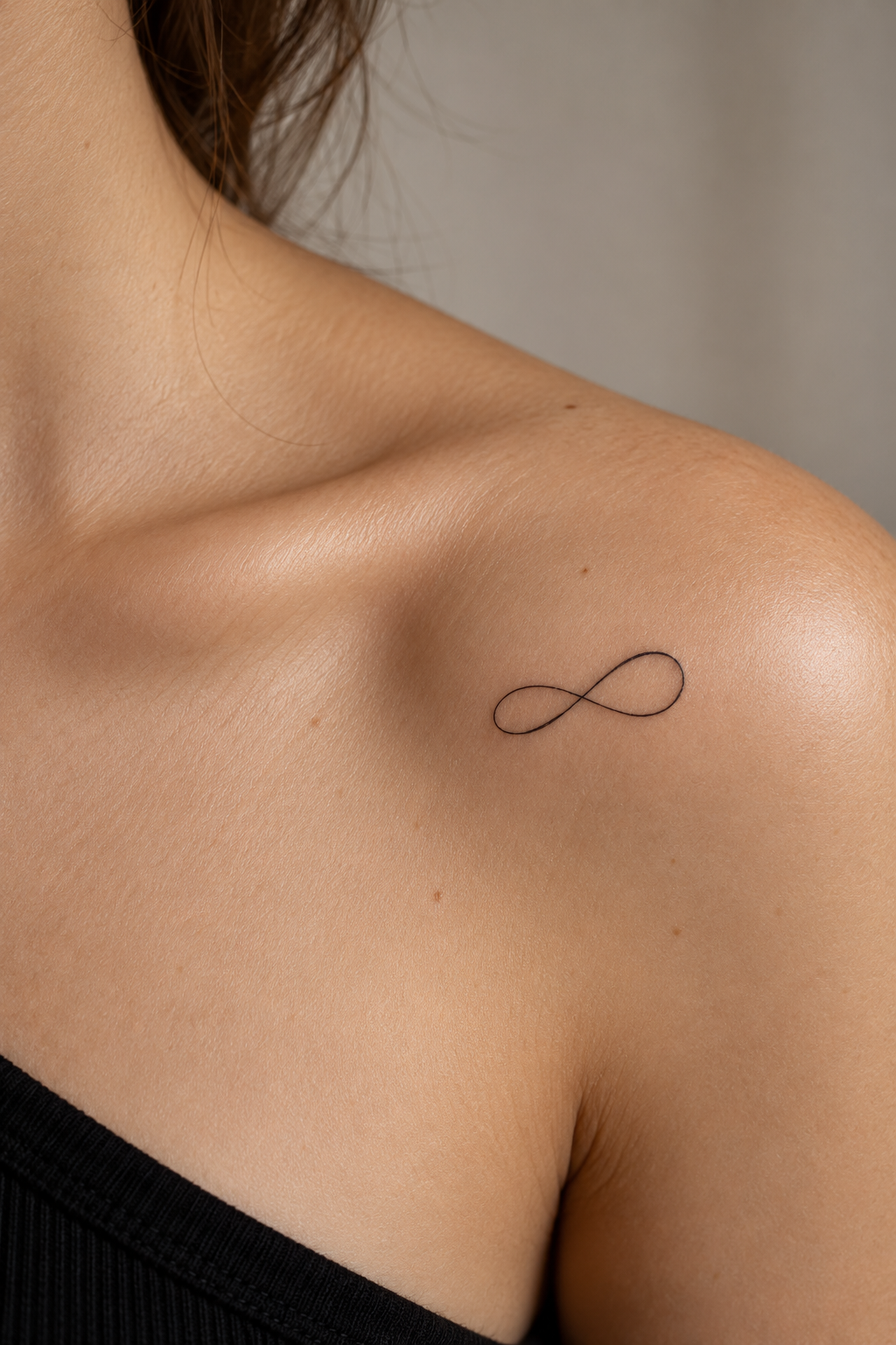 Tiny Meaningful Tattoo Ideas For Women featuring a small infinity mark symbol
