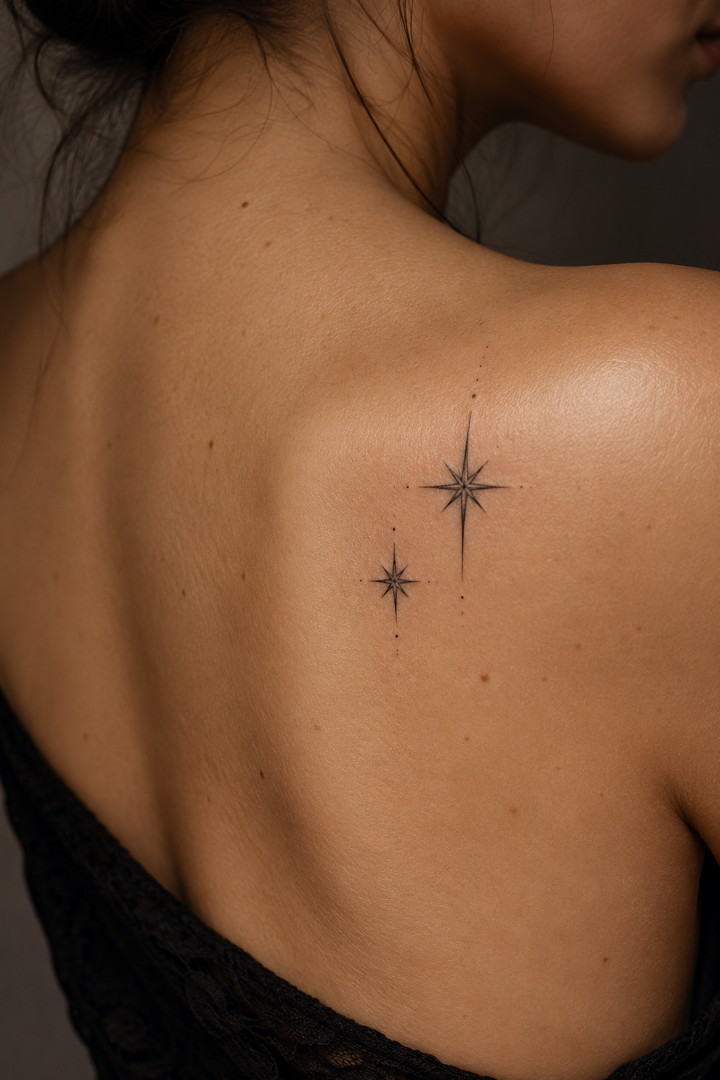 small dainty tattoo ideas: Fine-line star pair