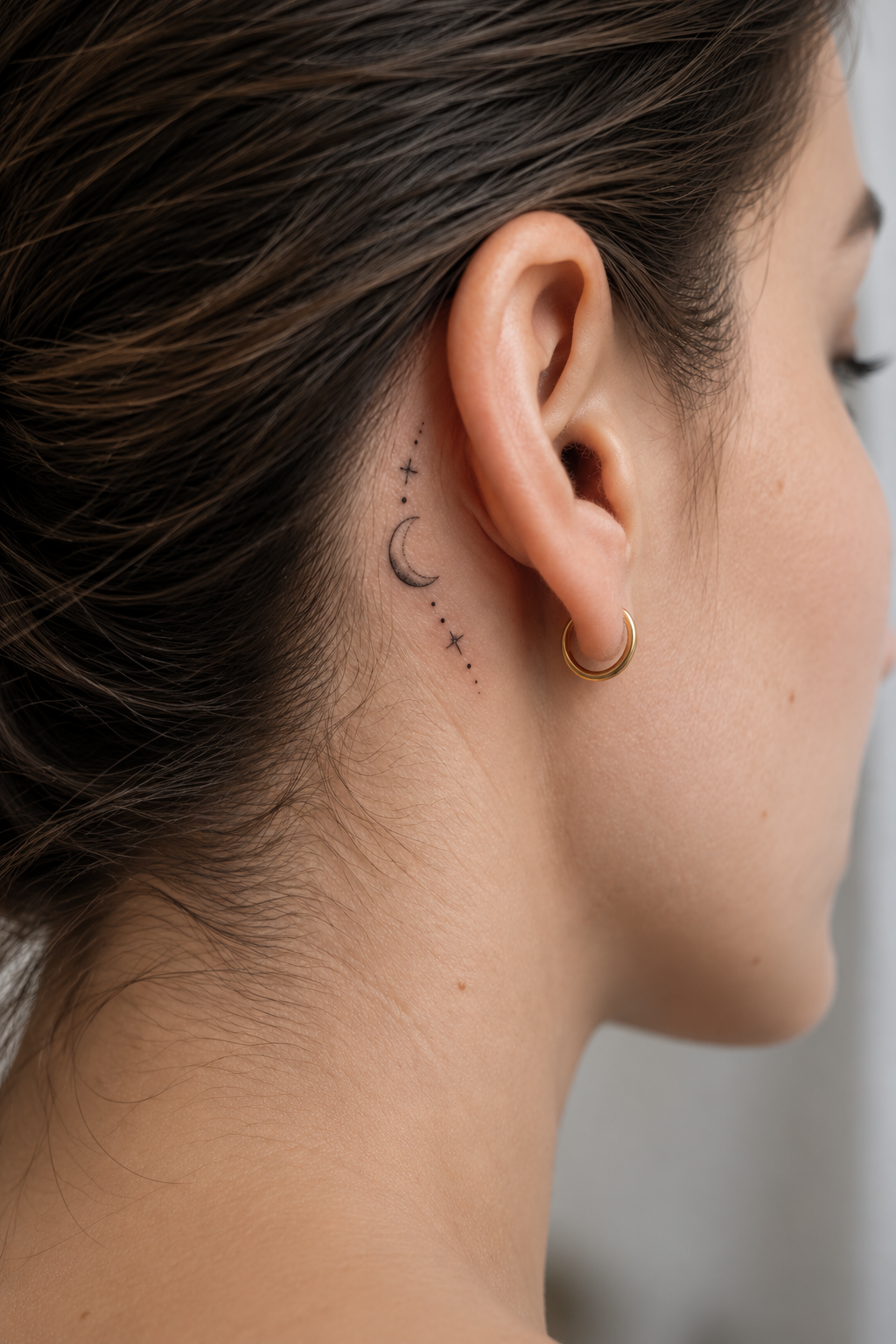 behind the ear tattoo ideas for women: crescent moon behind the ear