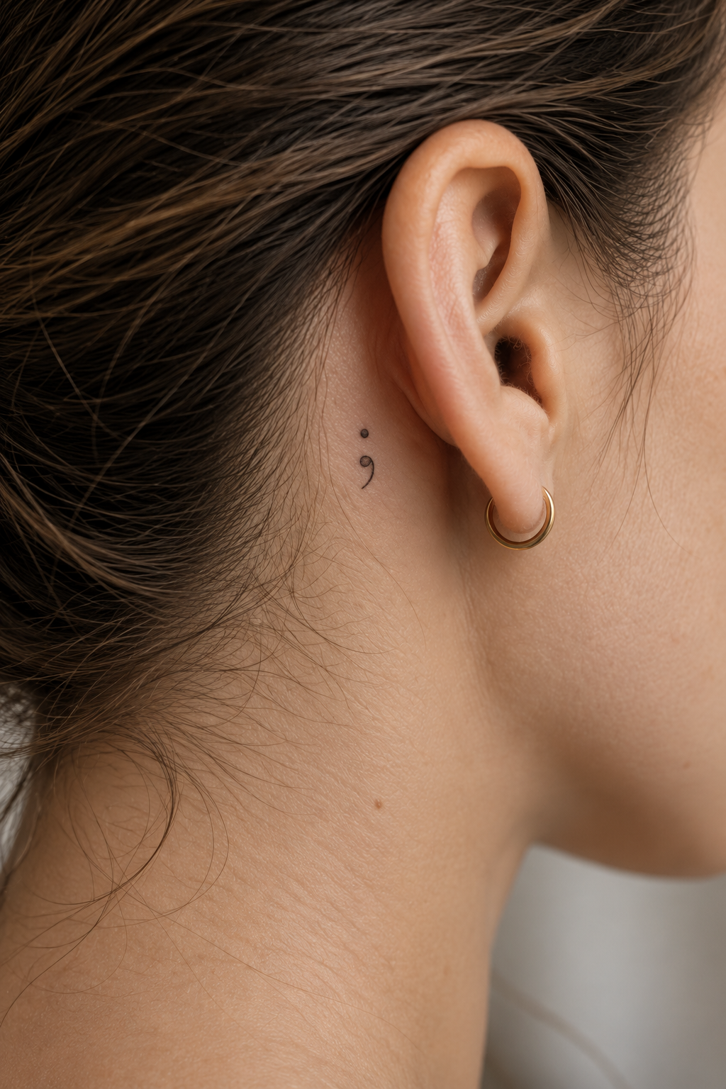 behind the ear tattoo ideas for women: a quiet semicolon mark