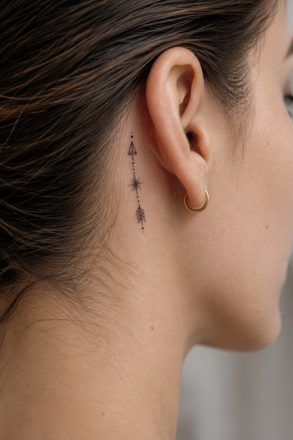 behind the ear tattoo ideas for women: fine-line arrow