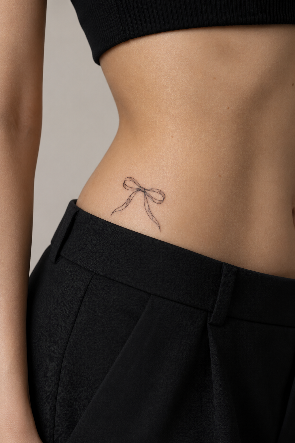 minimalist bow tattoos at the hip
